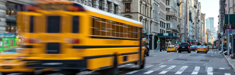 school bus in city traffic