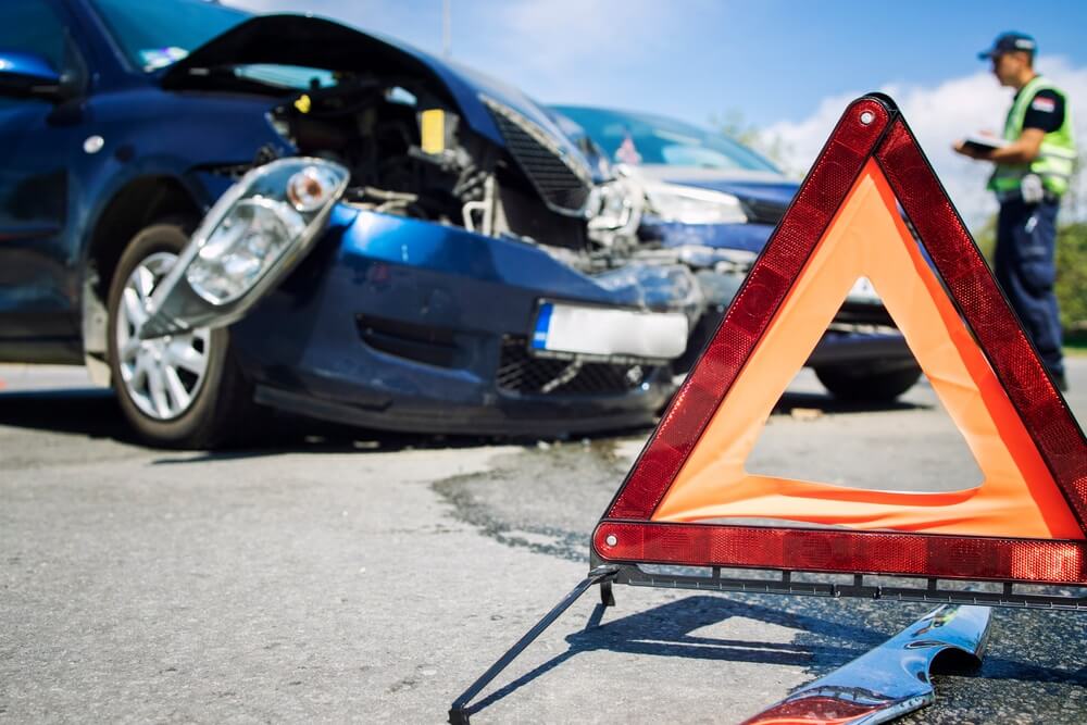 Car accident in the middle of intersection highway