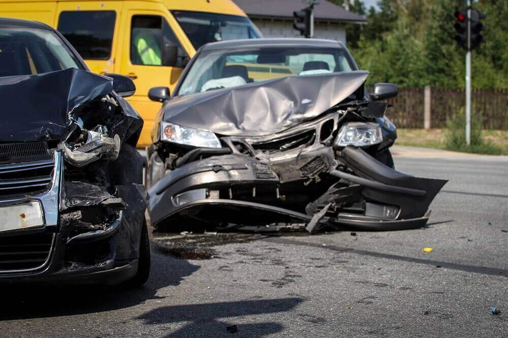 Car collision in the road causing traffic.