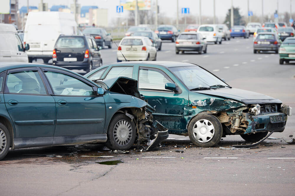 Cars in t-bone accident along the highway.