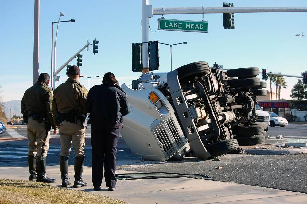 Truck overturn in the intersection highway