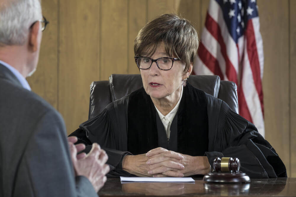 Lawyer and judge talking in the court.