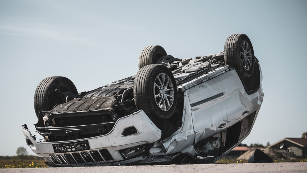 Rollover car in the middle of the highway