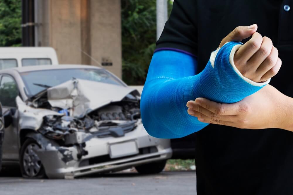 Driver got arm injury on bandage from car crash.