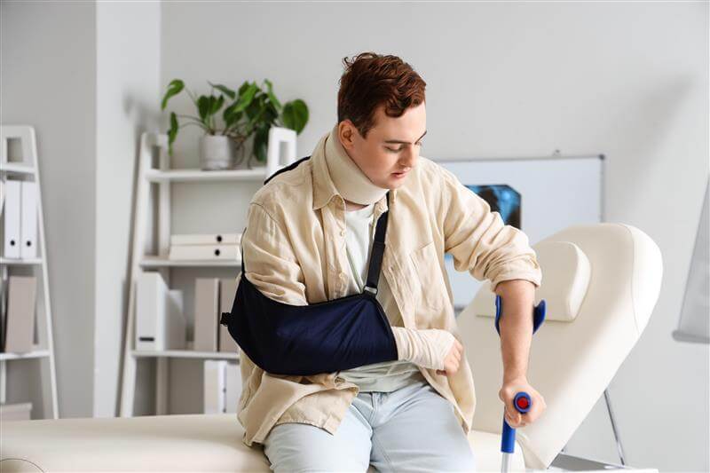 Man suffering neck and arm injury from accident.