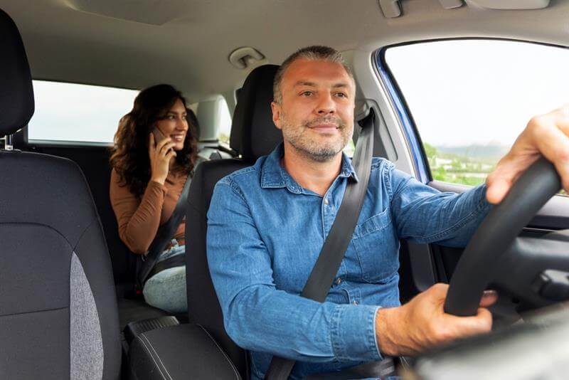 Lady passenger at the back taking calls.